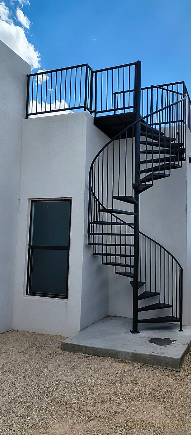 Custom hand-forged exterior spiral iron staircase to rooftop deck